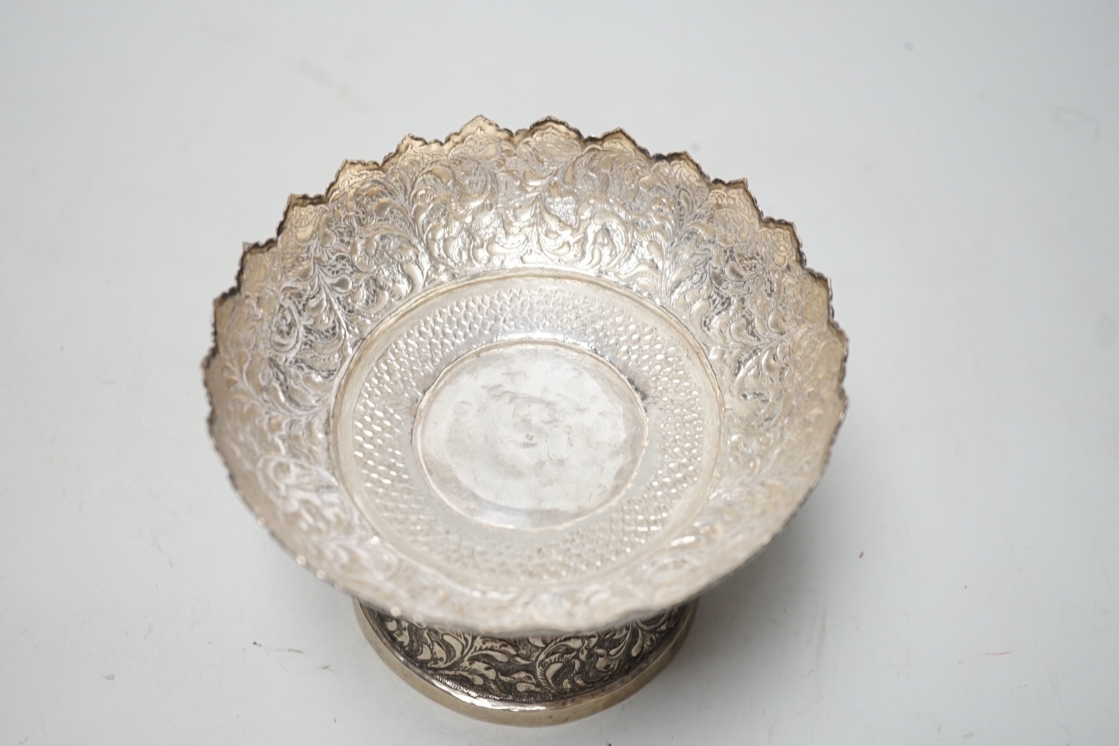 A Chinese Straits embossed white metal stem bowl, diameter 13cm, 172 grams.